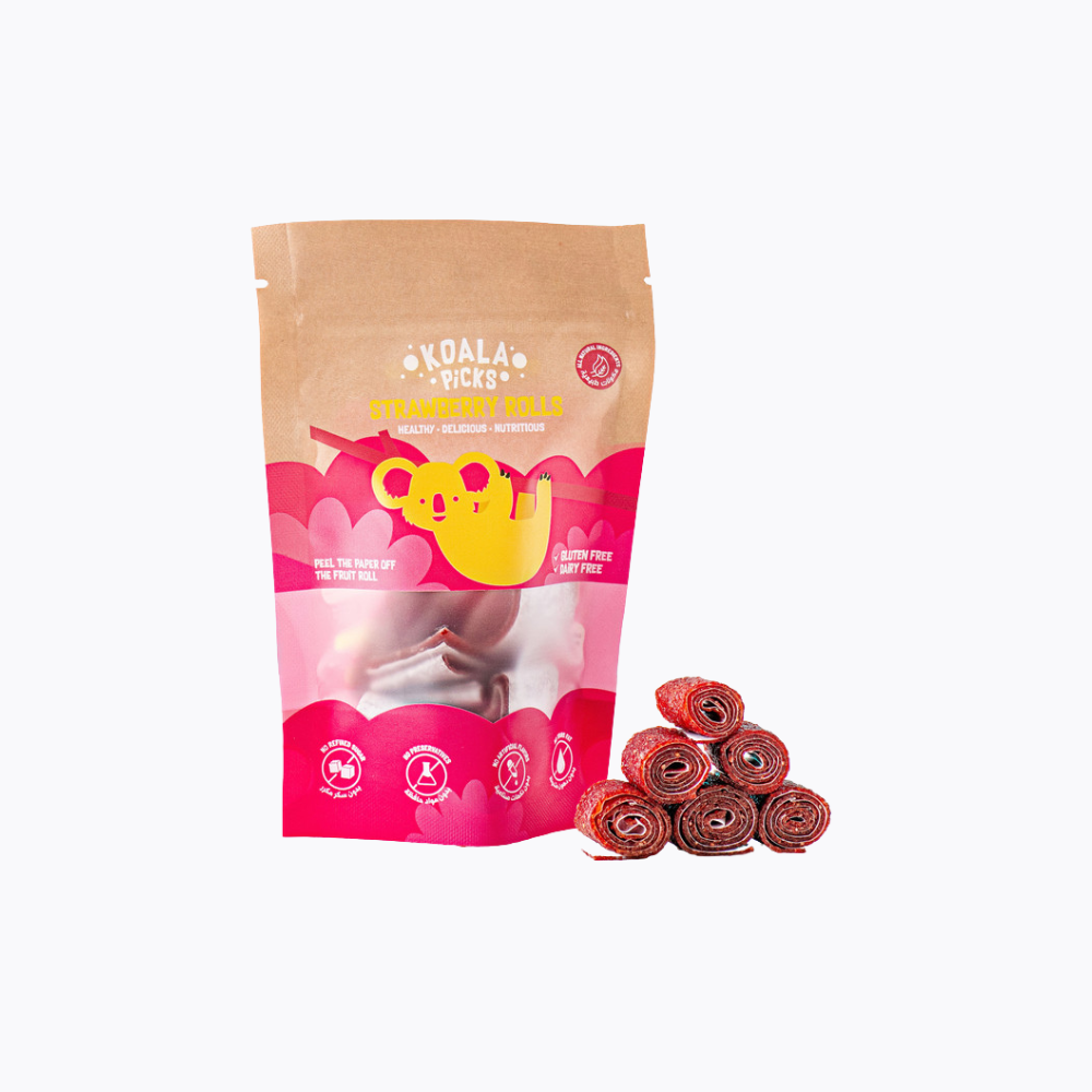 Pink packaging of Koala Yacks strawberry rolls with a small pile of rolls on a white background