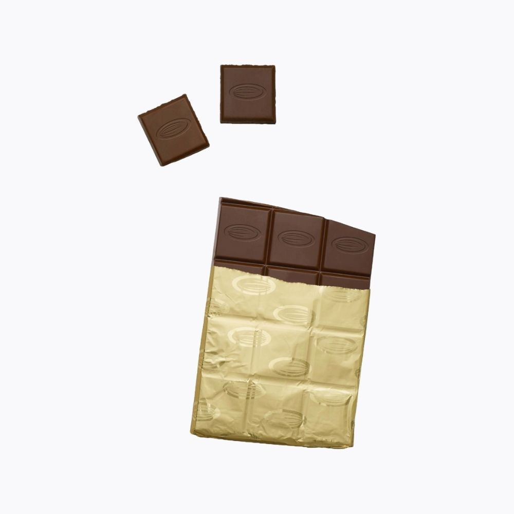 Chocolate bar with a gold wrapper on a white background