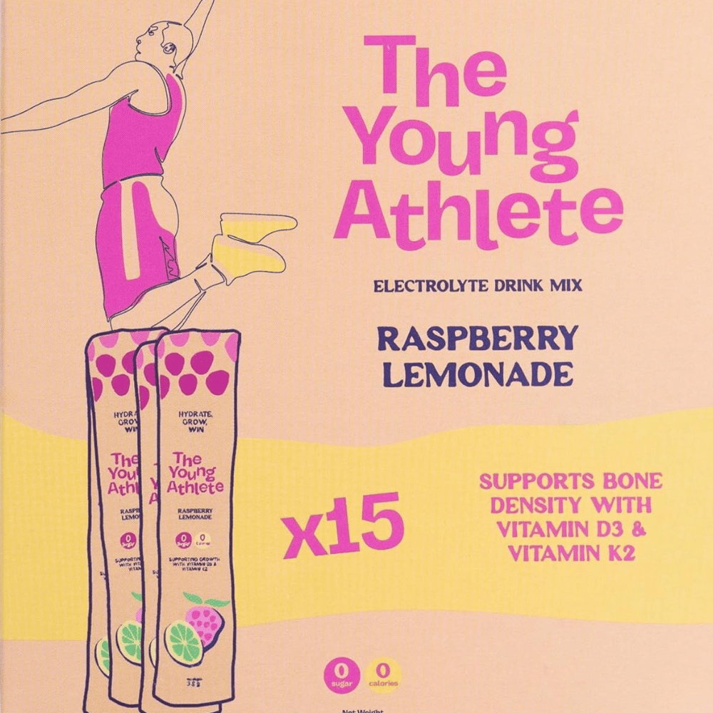 Advertisement for 'The Young Athlete' electrolyte drink mix in raspberry lemonade flavor on a beige background.