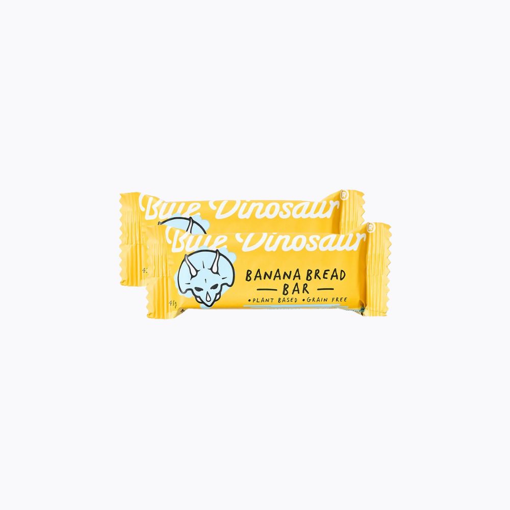 Yellow bar of 'Little Dinosaur' banana bread on a white background