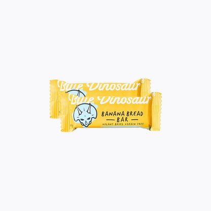 Yellow bar of 'Little Dinosaur' banana bread on a white background