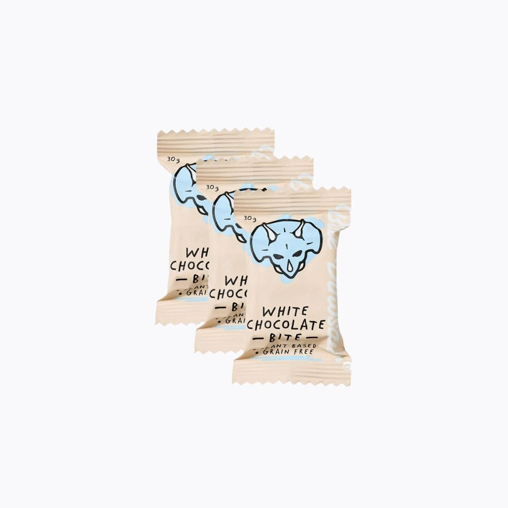Three packages of white chocolate bites with a blue logo on a white background