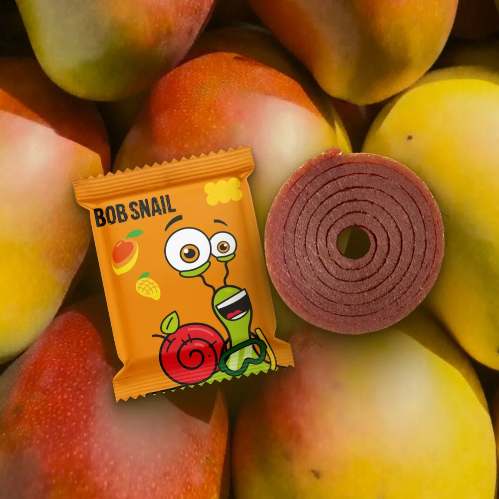 Bob Snail candy package with a candy roll on a background of peaches