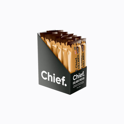 A black retail display box filled with individual collagen protein stick packets in tan and brown packaging, branded Chief, on a clean white background.