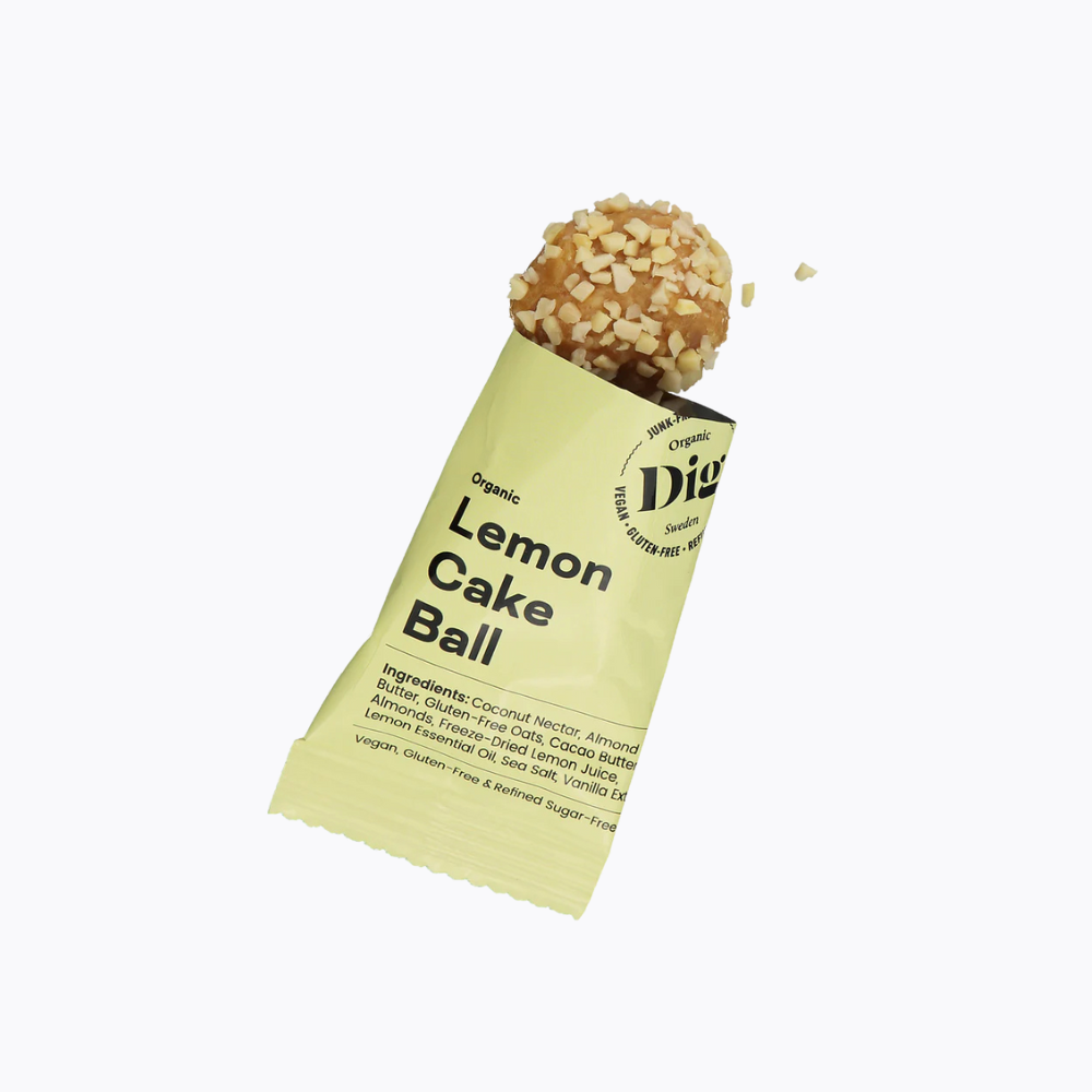 Lemon cake ball in a green package on a white background