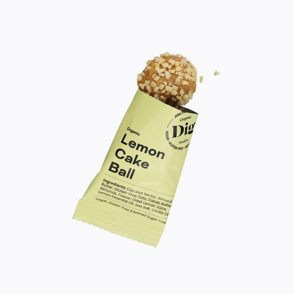 Lemon cake ball in a green package on a white background