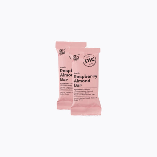 Two raspberry almond bars in pink packaging on a white background