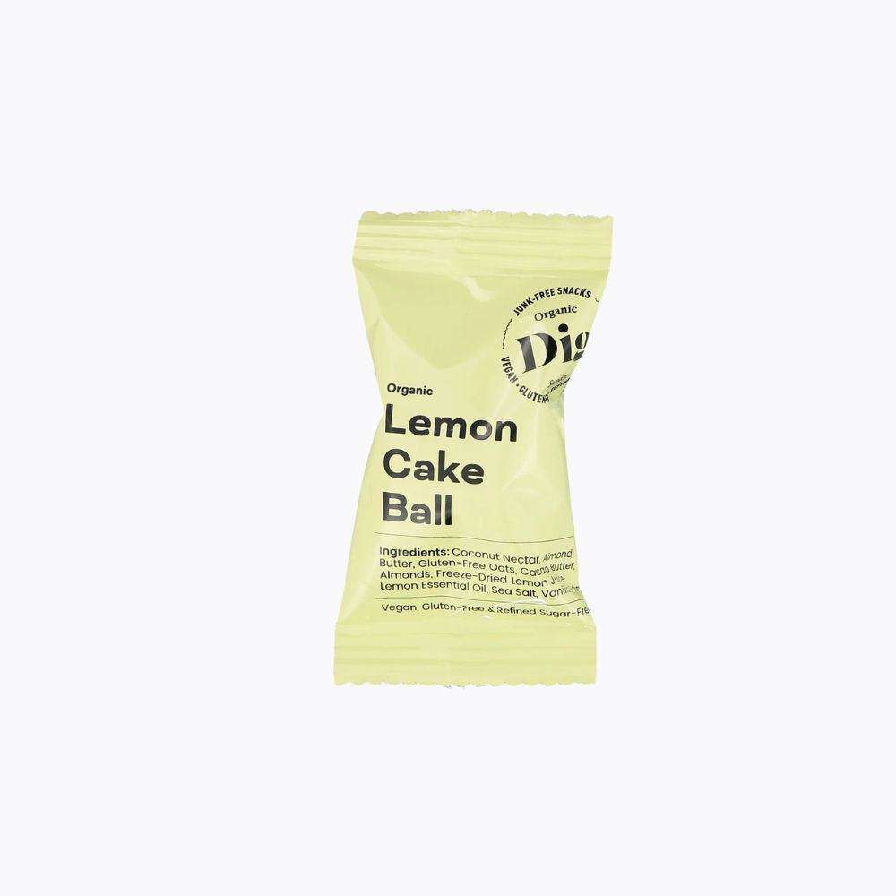 A single packaged lemon cake ball snack on a plain white background. The wrapper is pale yellow-green with black text reading 'Organic Lemon Cake Ball' and a circular logo that appears to say 'Digestive' and 'Non-GMO'.