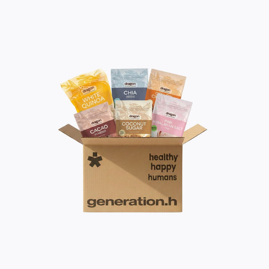 Box of 'healthy happy humans' with various health products on a white background