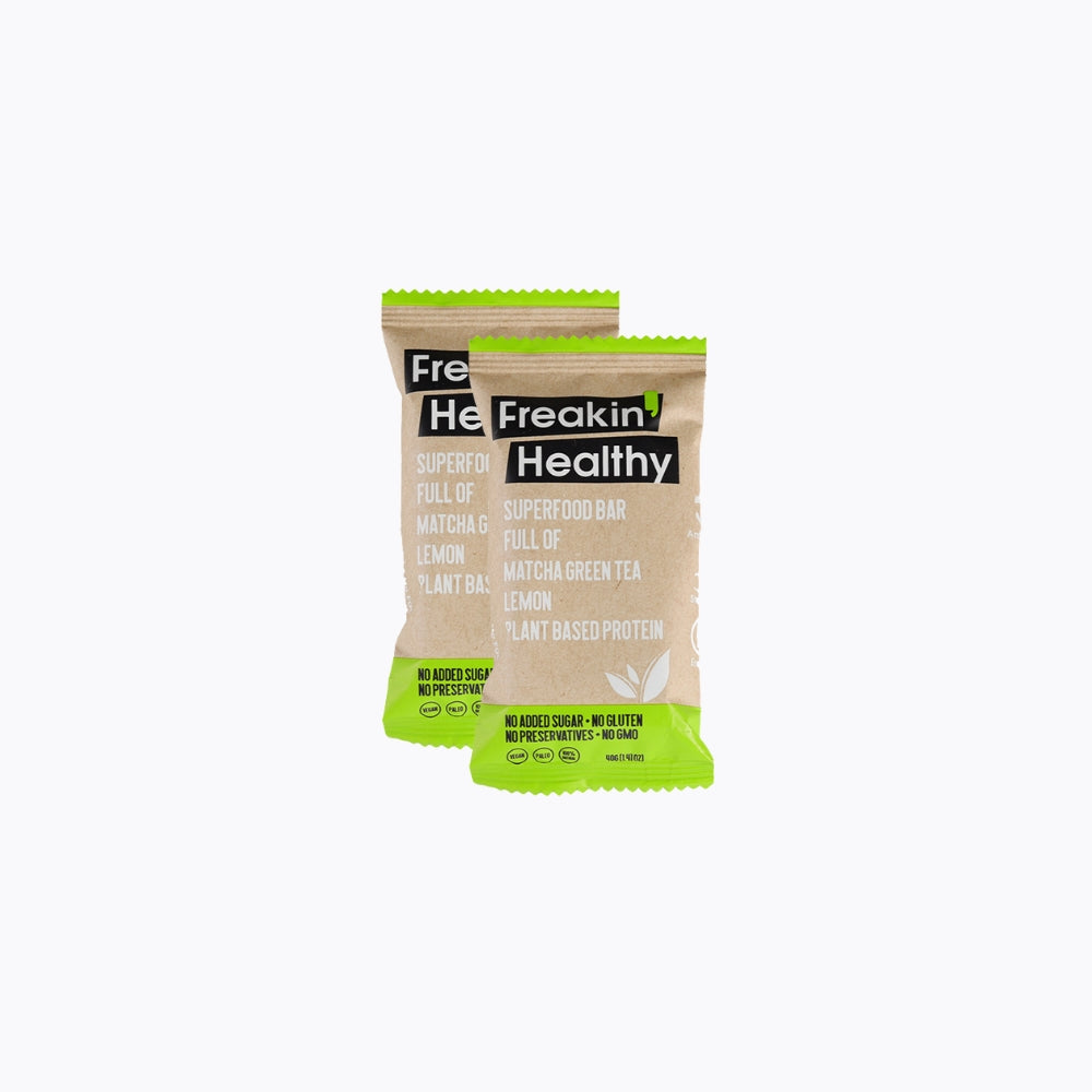 Two 'He Freakin' Healthy' protein bars on a white background