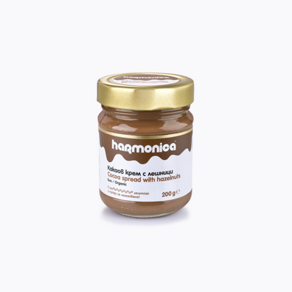 Jar of harmonica cocoa spread with hazelnuts on a white background