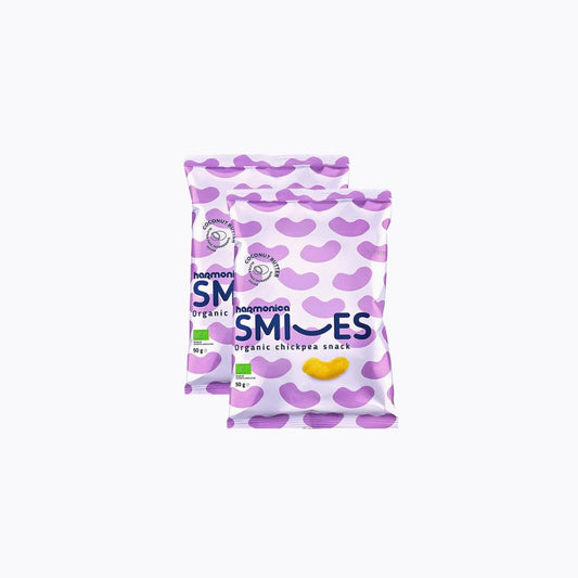 Two packages of Heumanni Smiles organic chickpea snack on a white background