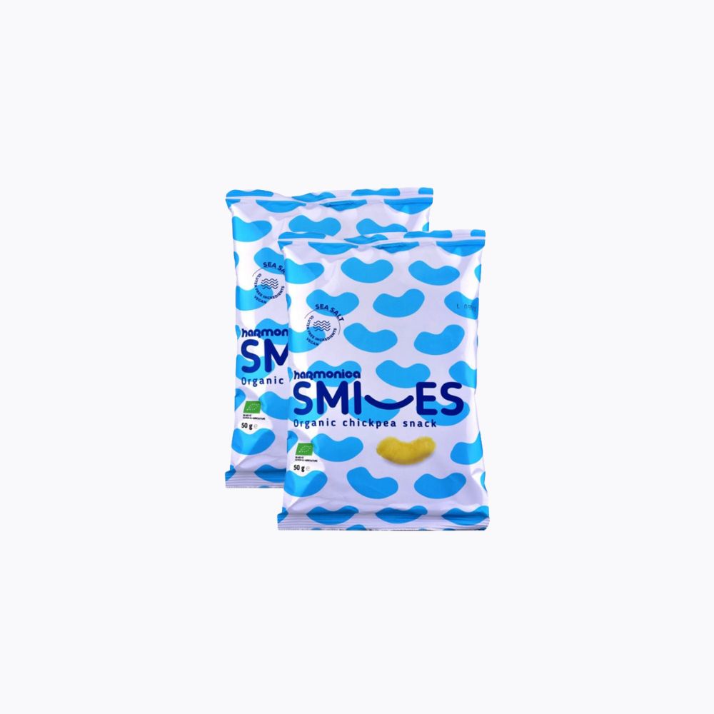 Two packages of Heumans Organic Smiles chickpea snack on a white background