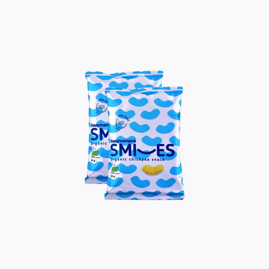 Two packages of Heumans Organic Smiles chickpea snack on a white background