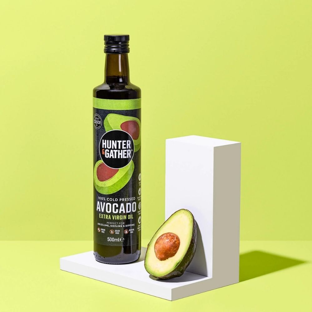 Hunter & Gather avocado oil bottle with an avocado on a green background