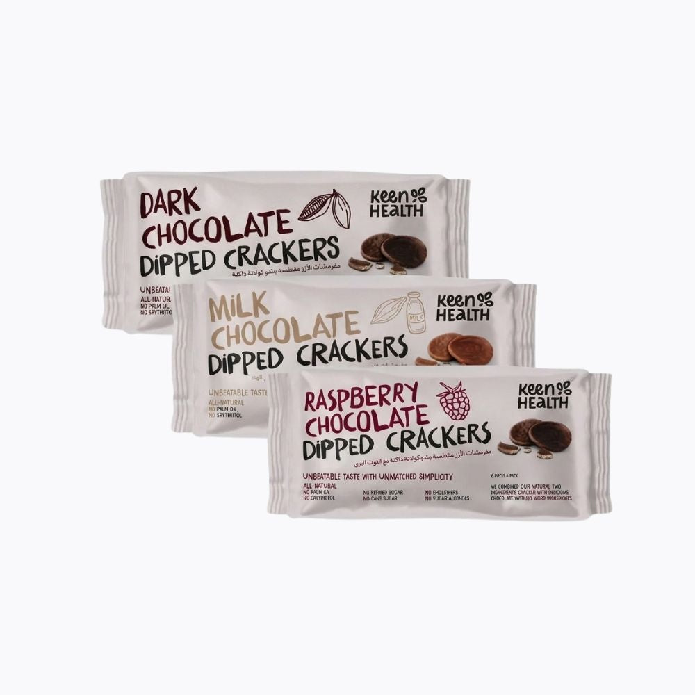 Three packaged bars of Keen & Health Dipped Crackers arranged in a fan shape on a plain white background: Dark Chocolate, Milk Chocolate, and Raspberry Chocolate varieties.