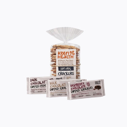 Keen Health Natural Crackers in a clear plastic bag with a white drawstring top, shown with three individually wrapped dipped cracker packs in front on a light gray background.