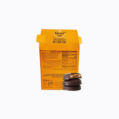Orange packaging of Kinni Life pecan pie cookies with a cookie on a white background