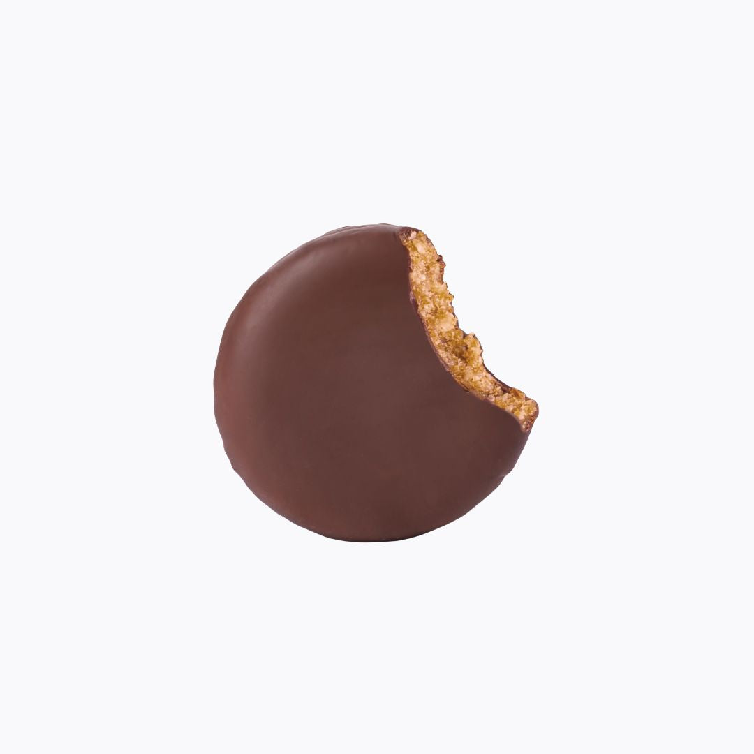Chocolate-dipped cookie with a bite taken out on a white background