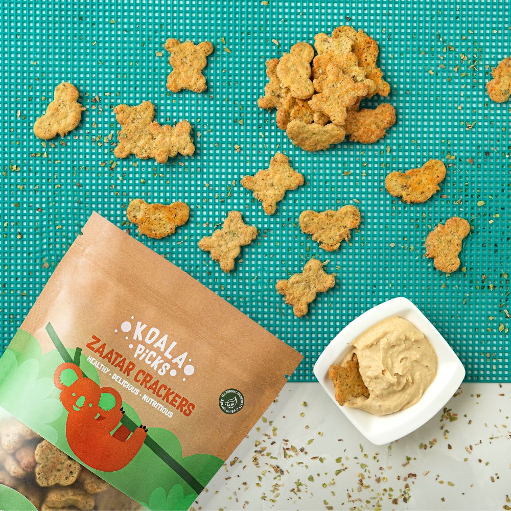 Zatar crackers with a Koala Picks packaging on a green mat