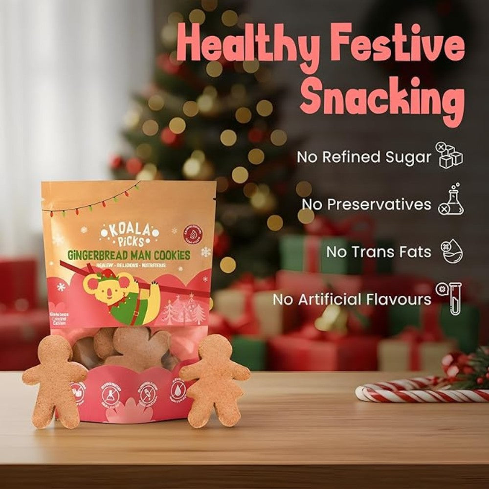 Packaging of Koala Pops Gingerbread Man Cookies with Christmas tree and presents in the background