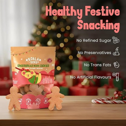 Packaging of Koala Pops Gingerbread Man Cookies with Christmas tree and presents in the background