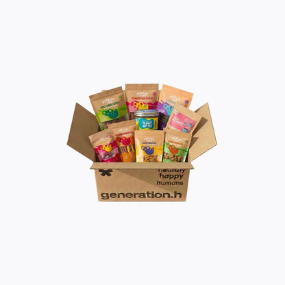 A cardboard gift box filled with assorted packaged snacks and treats on a plain white background. The box is branded 'generation.