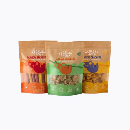 Three stand-up pouches of Koala Picks animal crackers arranged side by side on a light gray background. The pouches are labeled Rainbow Breadsticks, Zaba Crackers, and Cheese Crackers, with colorful graphics and clear windows showing the crackers inside.