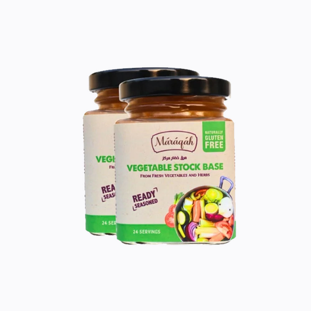 Two jars of vegetable stock base on a white background