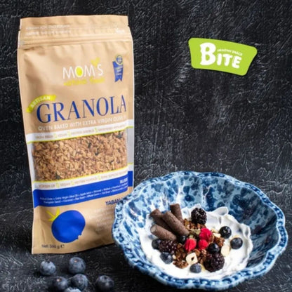 Mom's Granola package with a bowl of granola and yogurt on a dark background