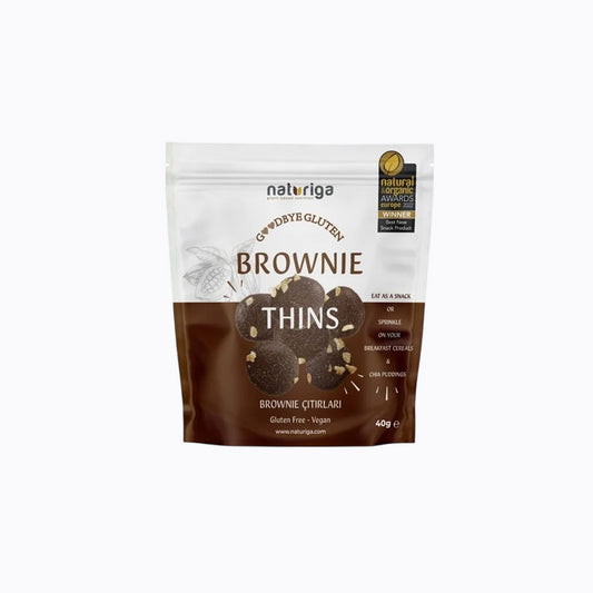 A 30g stand-up pouch of Naturiga Gluten Free Keto Granola, featuring a cream-colored top half, brown text, and a clear window showing the granola inside, set against a plain white background.