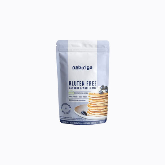 A 30g stand-up pouch of Naturiga Gluten Free Keto Granola, featuring a cream-colored top half, brown text, and a clear window showing the granola inside, set against a plain white background.