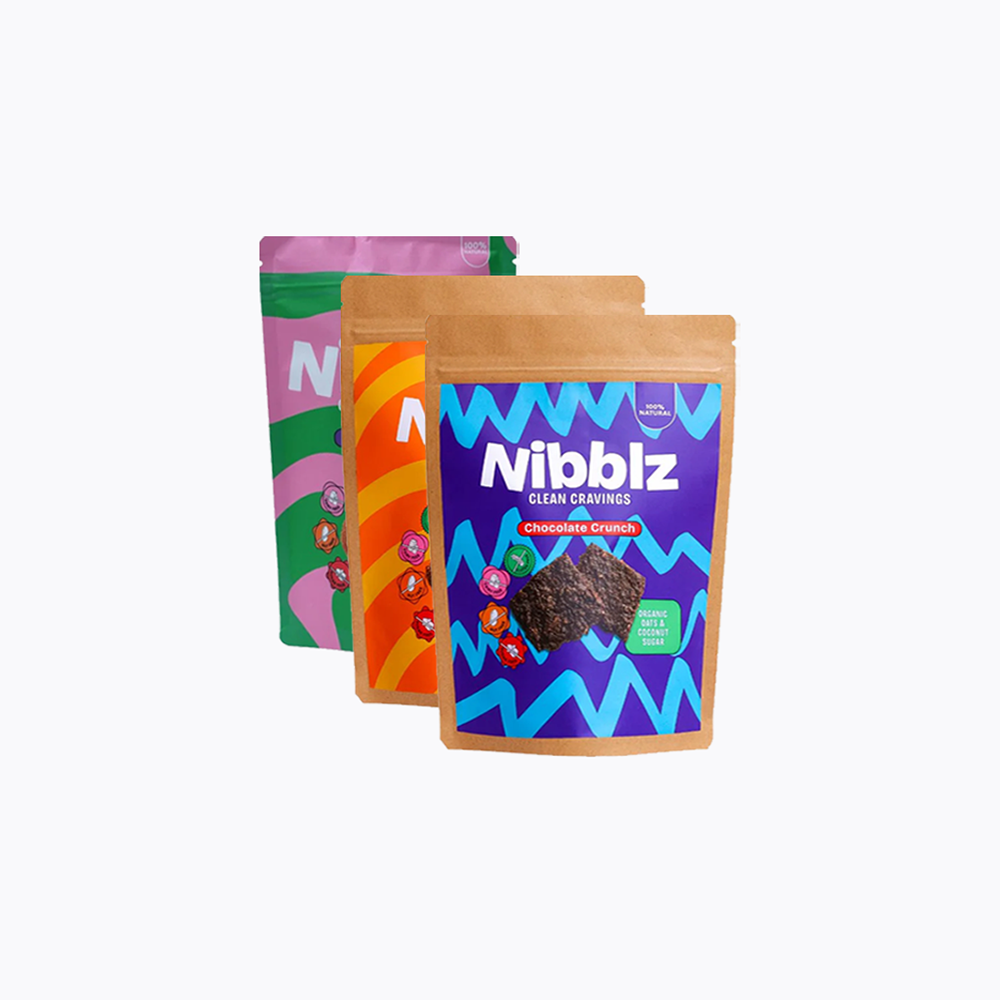 Three Nibblz snack packages on a white background