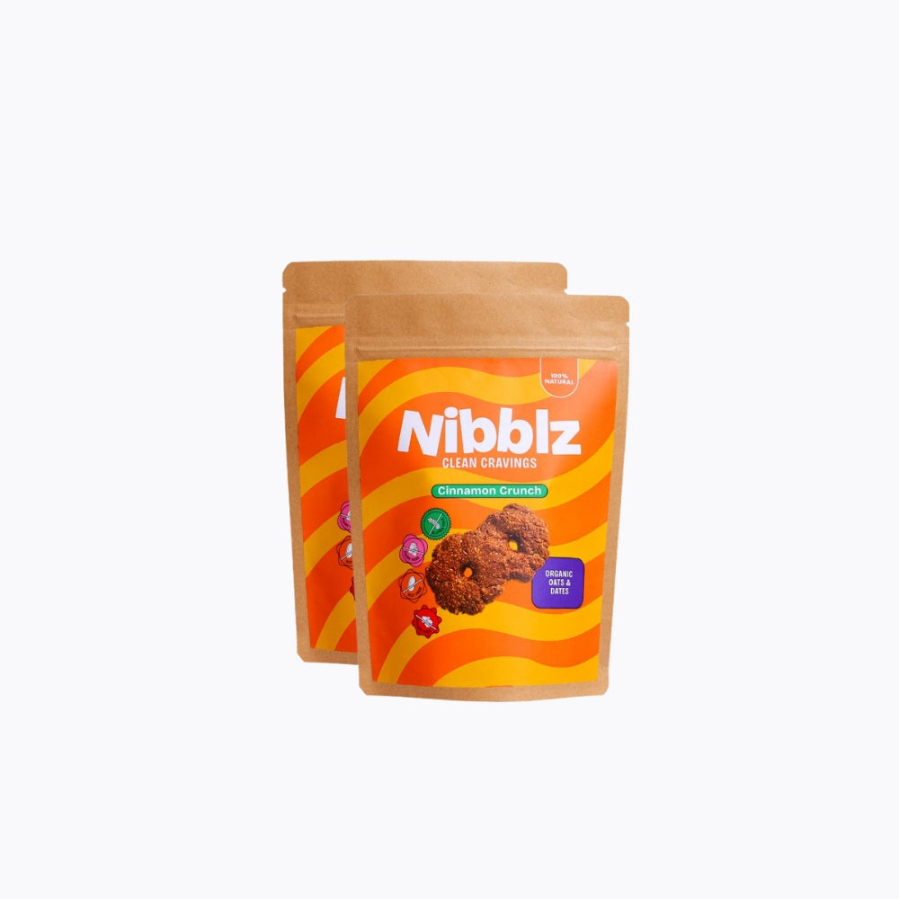 Two packages of Nibblz Cinnamon Crunch cookies on a white background