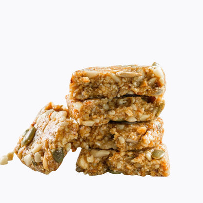 Stack of energy bars with seeds on a white background