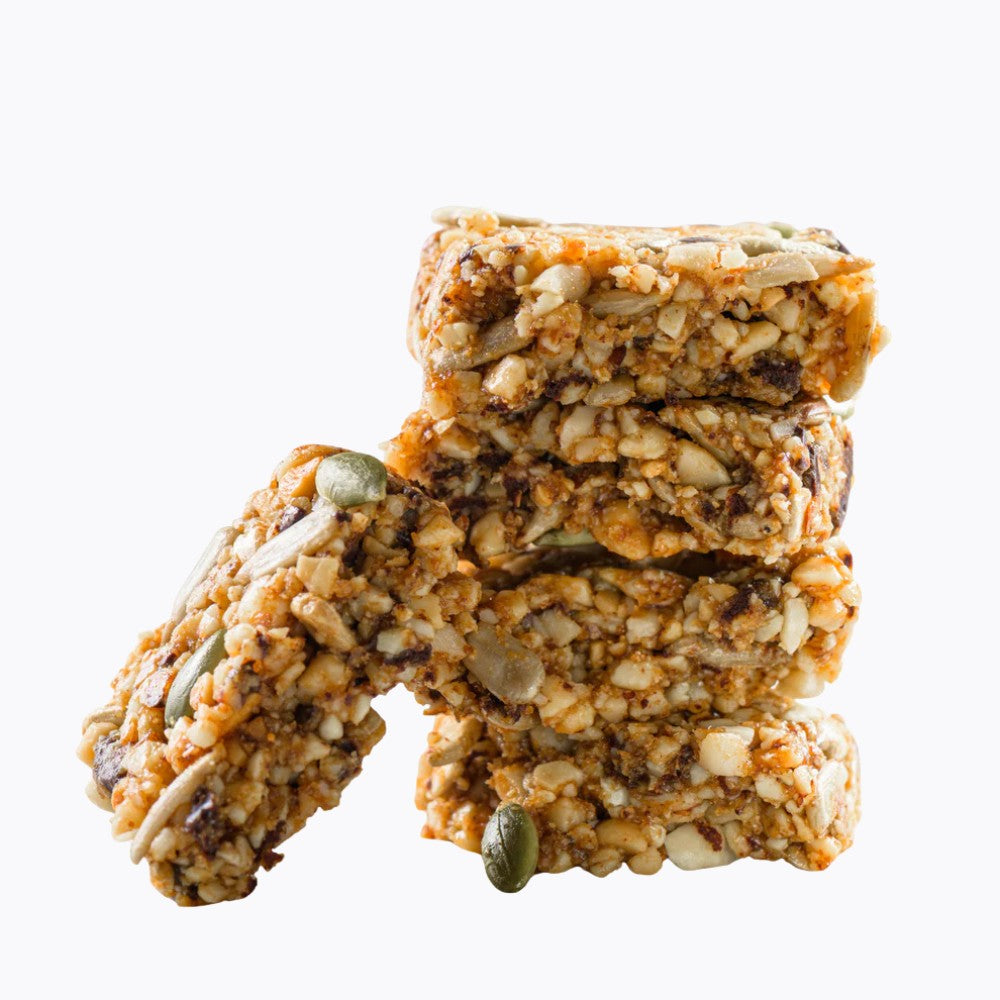 Stack of granola bars with seeds on a white background