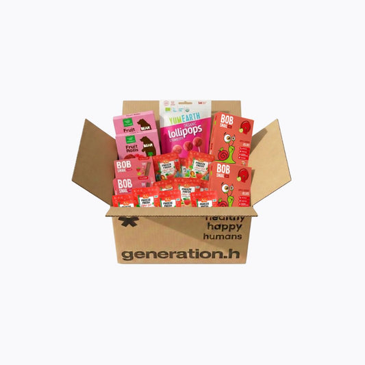 Cardboard box with health and wellness products from brands like Bob's Red Mill and Tim's Earth on a white background.