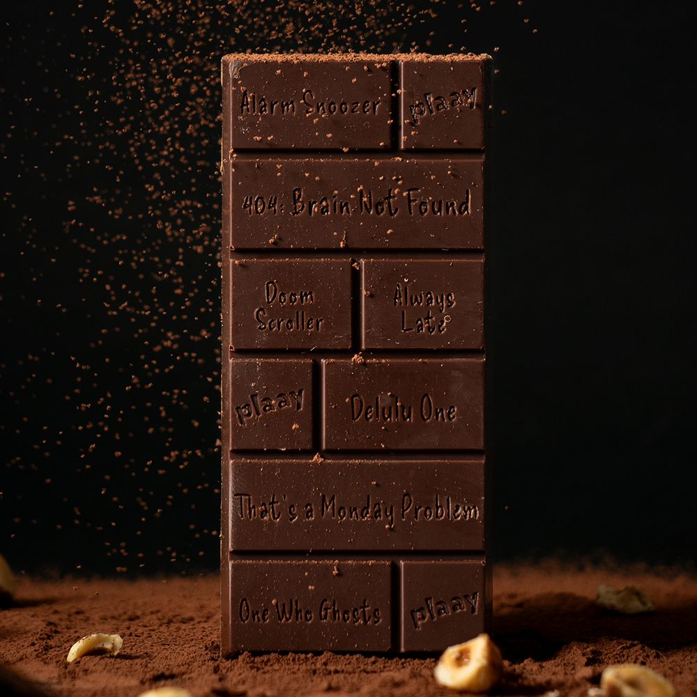 Stack of chocolate bars with humorous text on a dark background