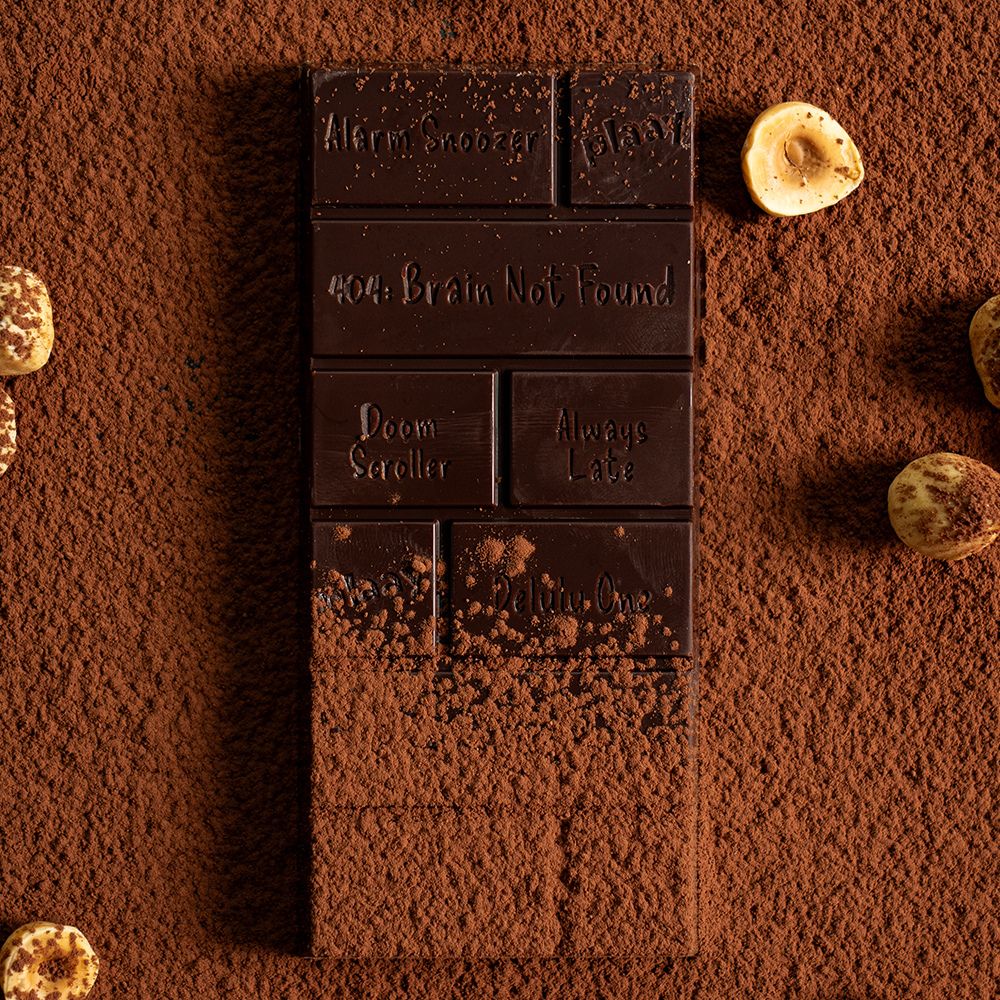 Dark chocolate bar with unique names on a cocoa powder background