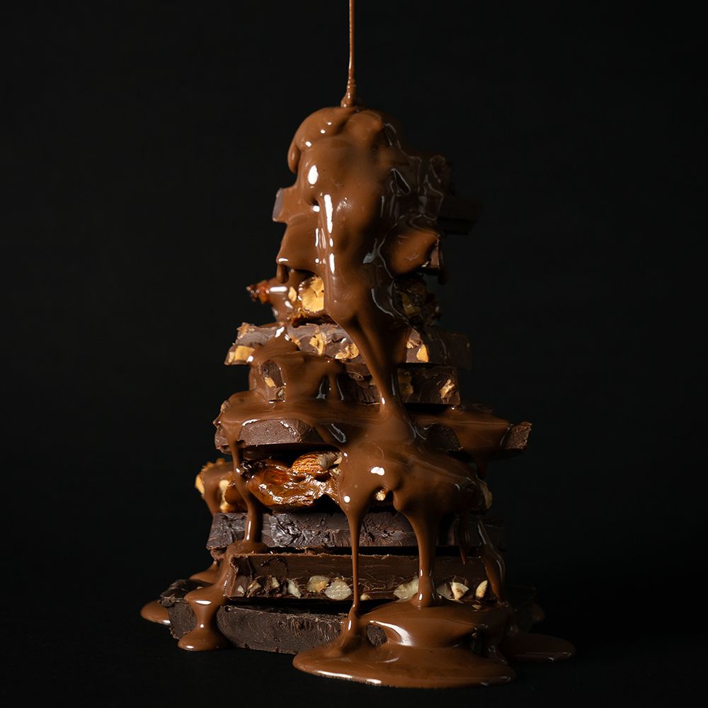 Chocolate-covered layered dessert with a dark background