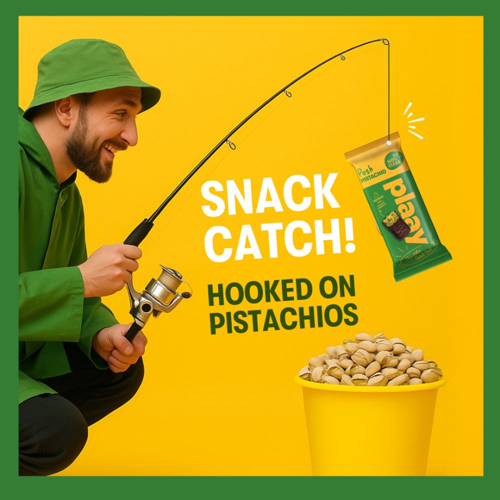 Man in green jacket and hat holding a fishing rod with a bag of pistachios on a yellow background