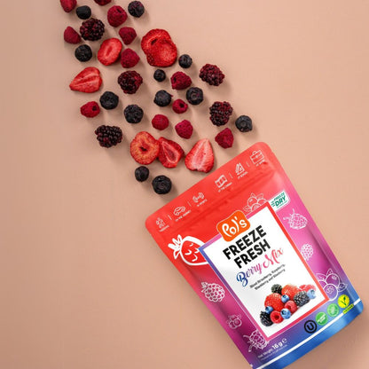 Bag of Bob's Freeze Fresh Berry Mix on a beige background with fresh berries.