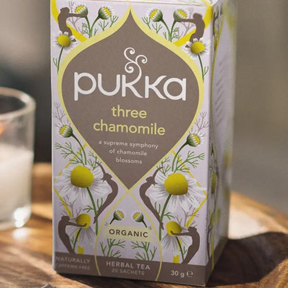 Pukka three chamomile tea box on a wooden surface