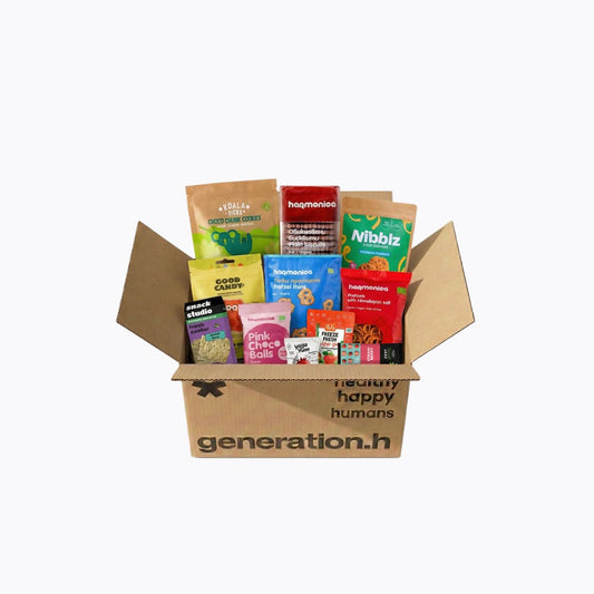 Open box from 'generation.h' with various snack packages inside on a white background