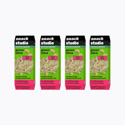 Multiple packages of Snack Studio green olive snack squares on a white background