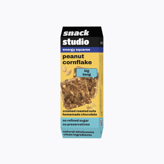 Box of Snack Studio peanut cornflake energy squares on a white background