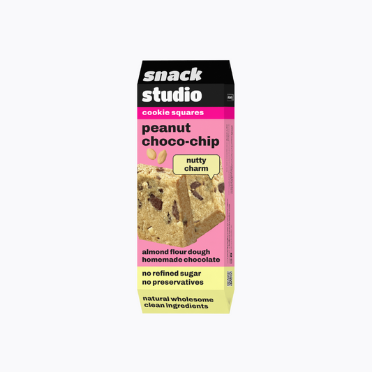 Box of Snack Studio peanut choco-chip cookie squares on a white background