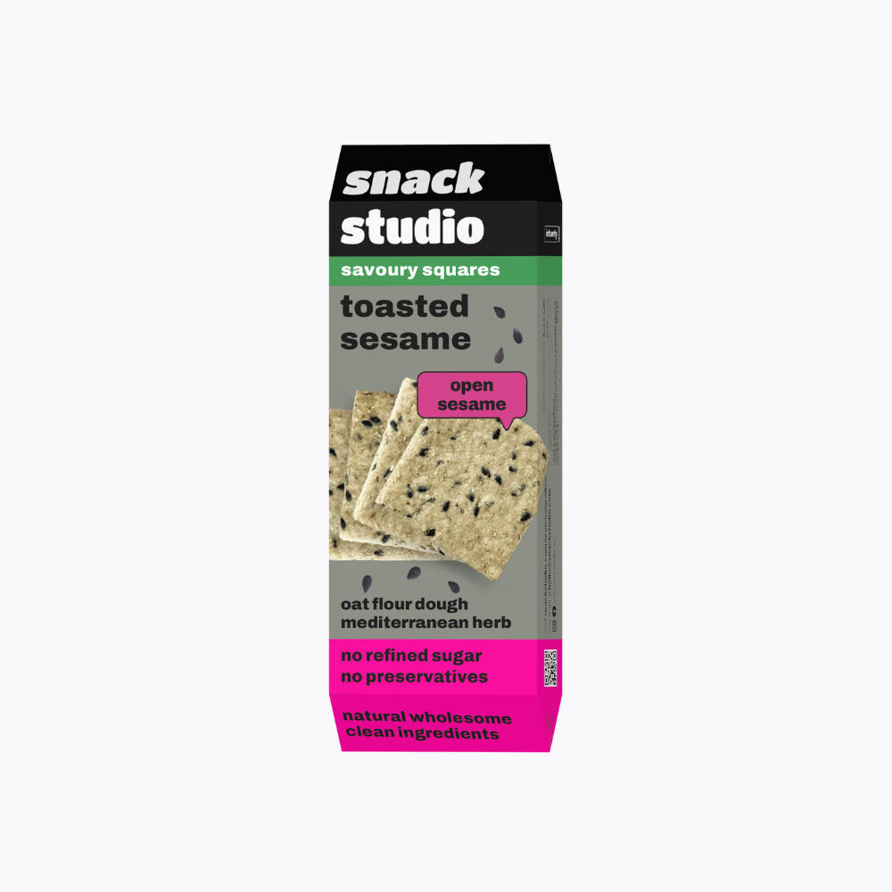 Box of snack studio toasted sesame savoury squares on a white background