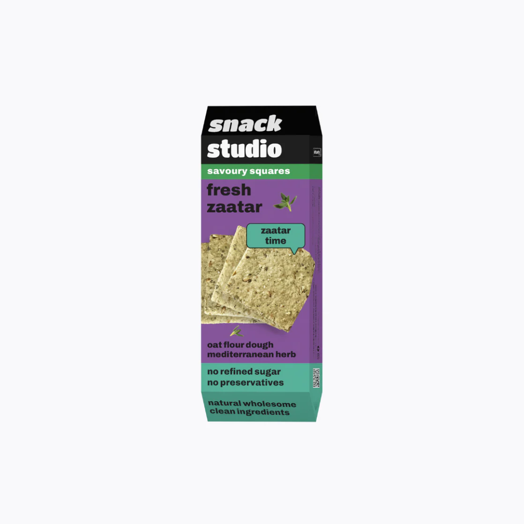 Snack Studio savory squares packaging with a purple background