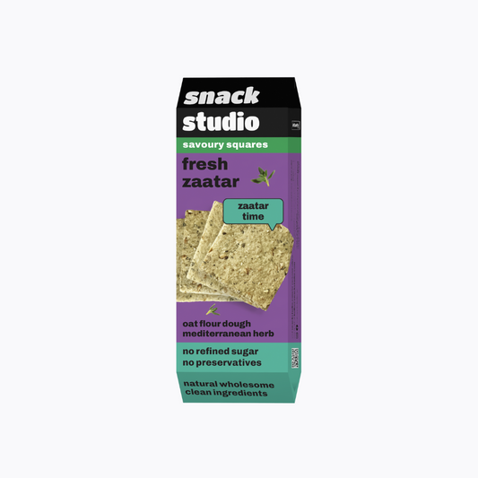 Snack Studio savory squares packaging with a purple background